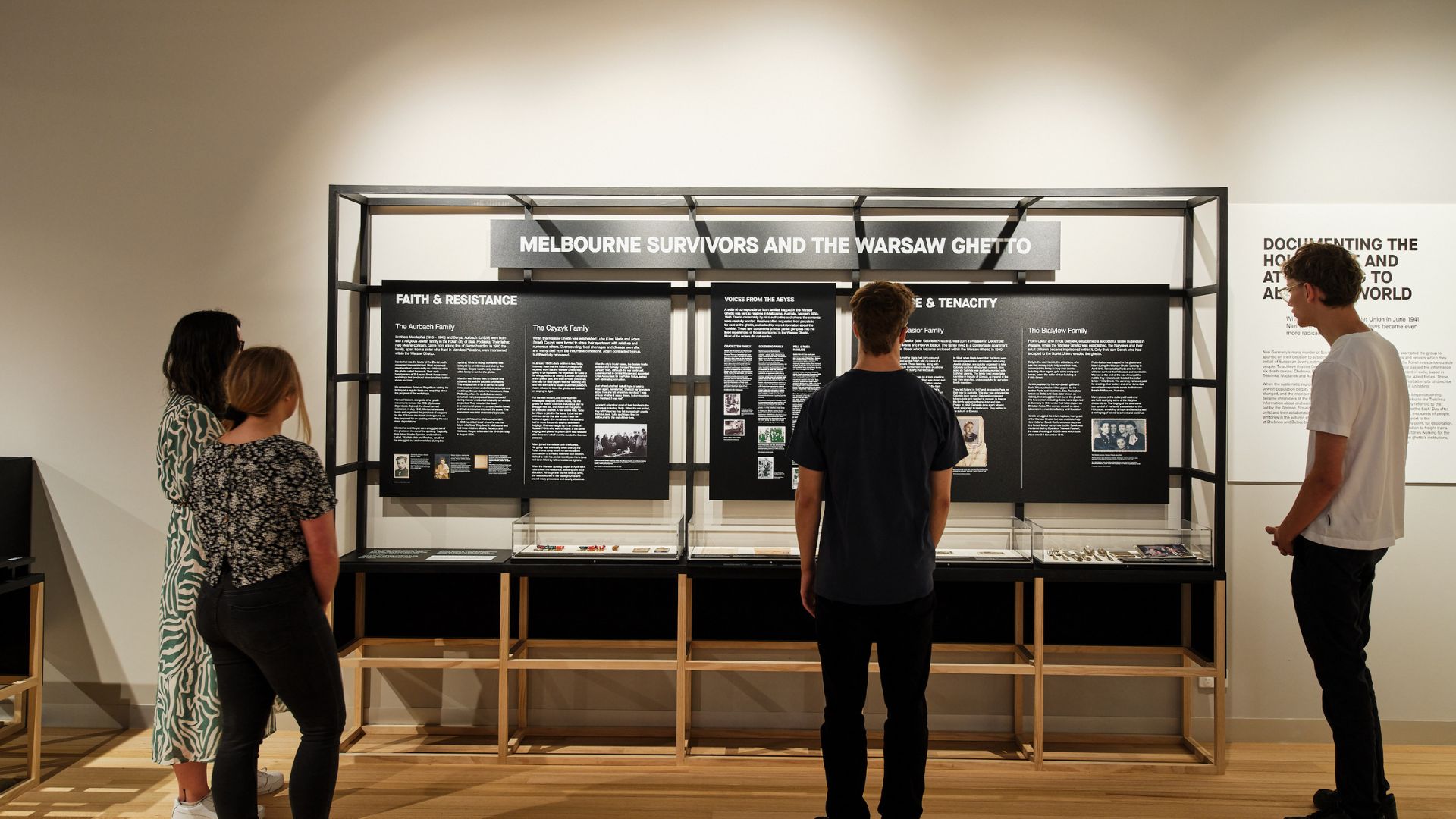 Visitors exploring the Melbourne display case within the &#039;Underground&#039; exhibition. Photographed by Simon Shiff. 